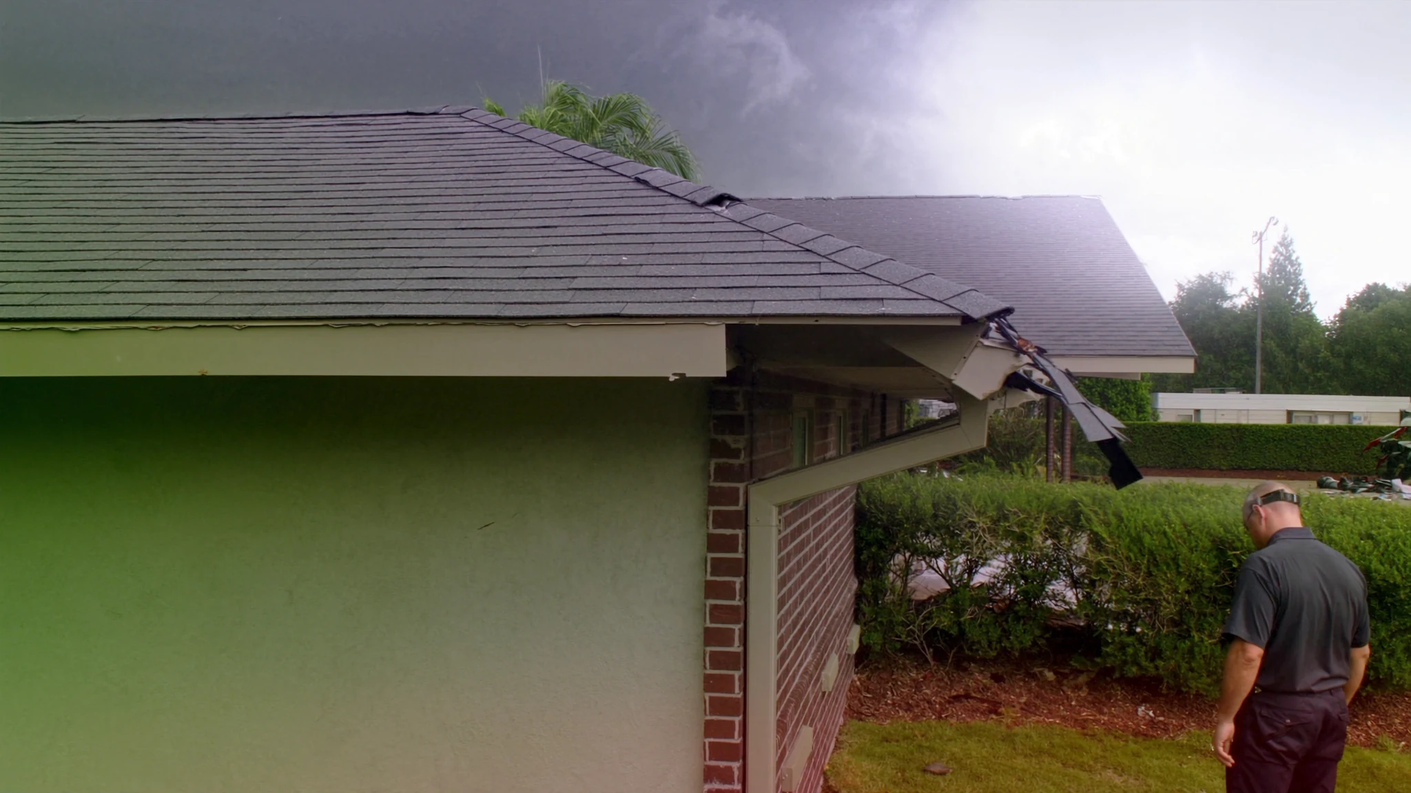 A property claim professional inspecting storm damage at a Texas property